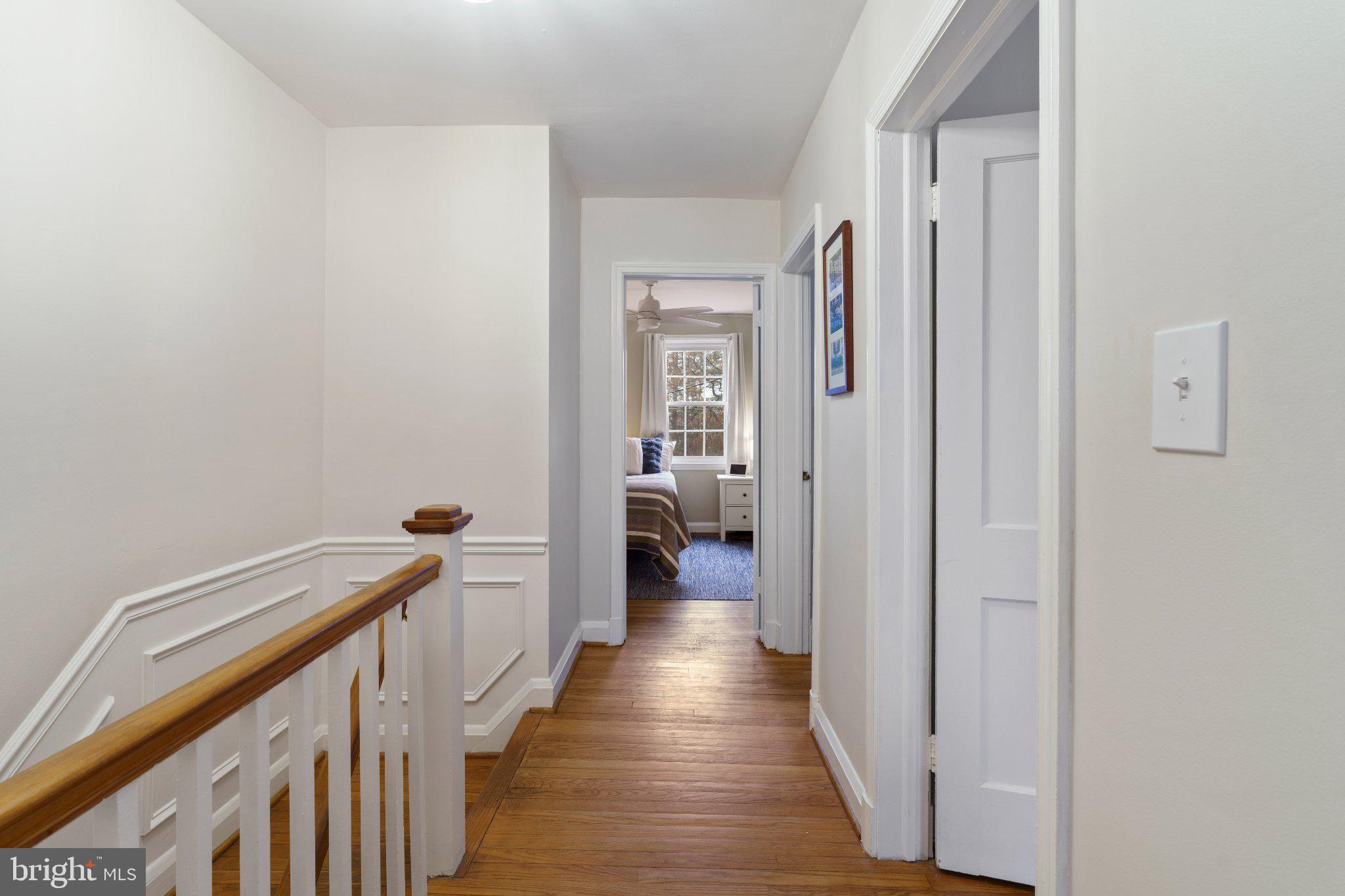142 Regester Avenue Baltimore, MD 21212 - Photo 19 of 36 Inviting hallway with warm wood accents.