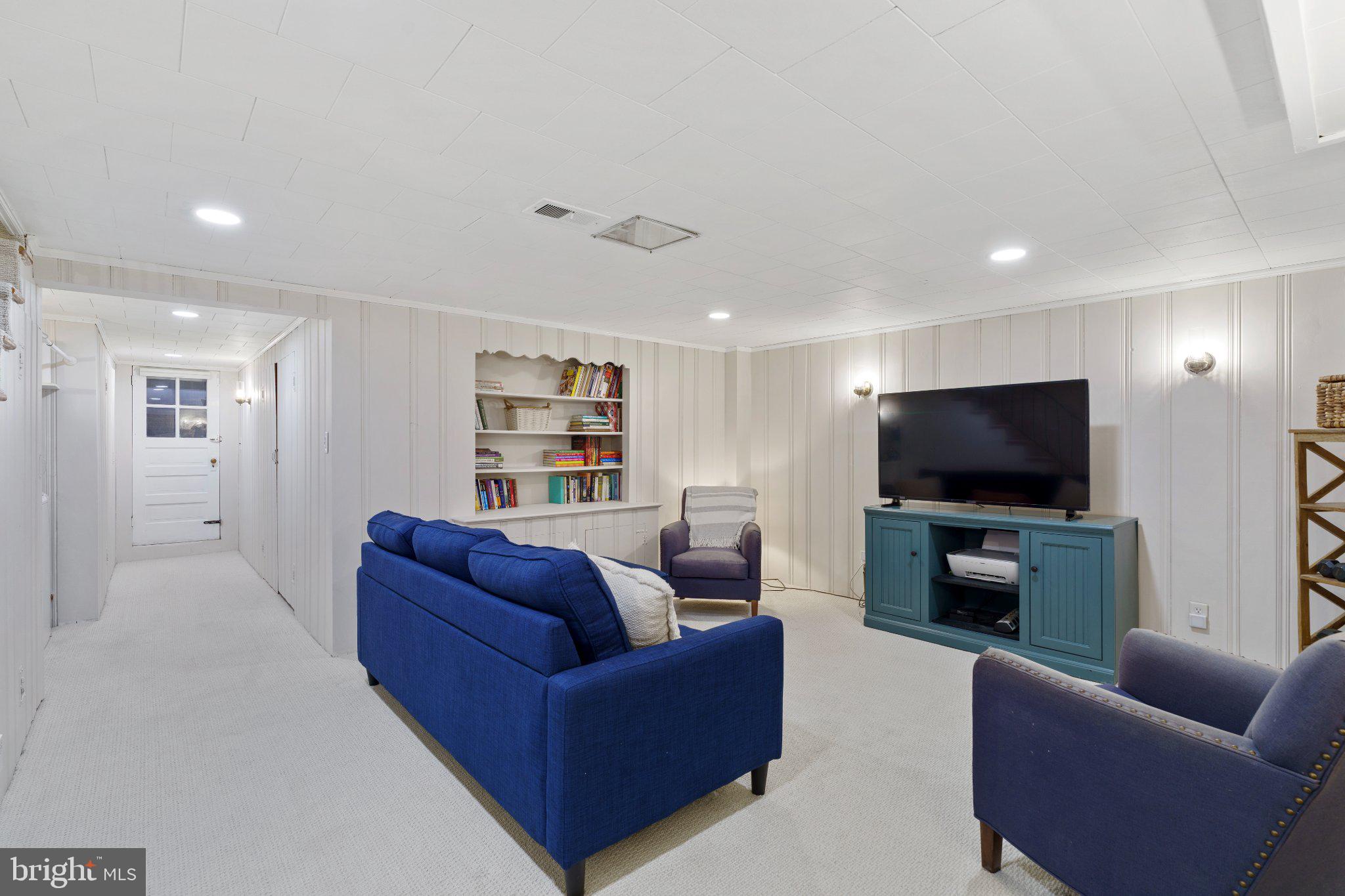 142 Regester Avenue Baltimore, MD 21212 - Photo 26 of 36 Cozy basement retreat with modern flair.