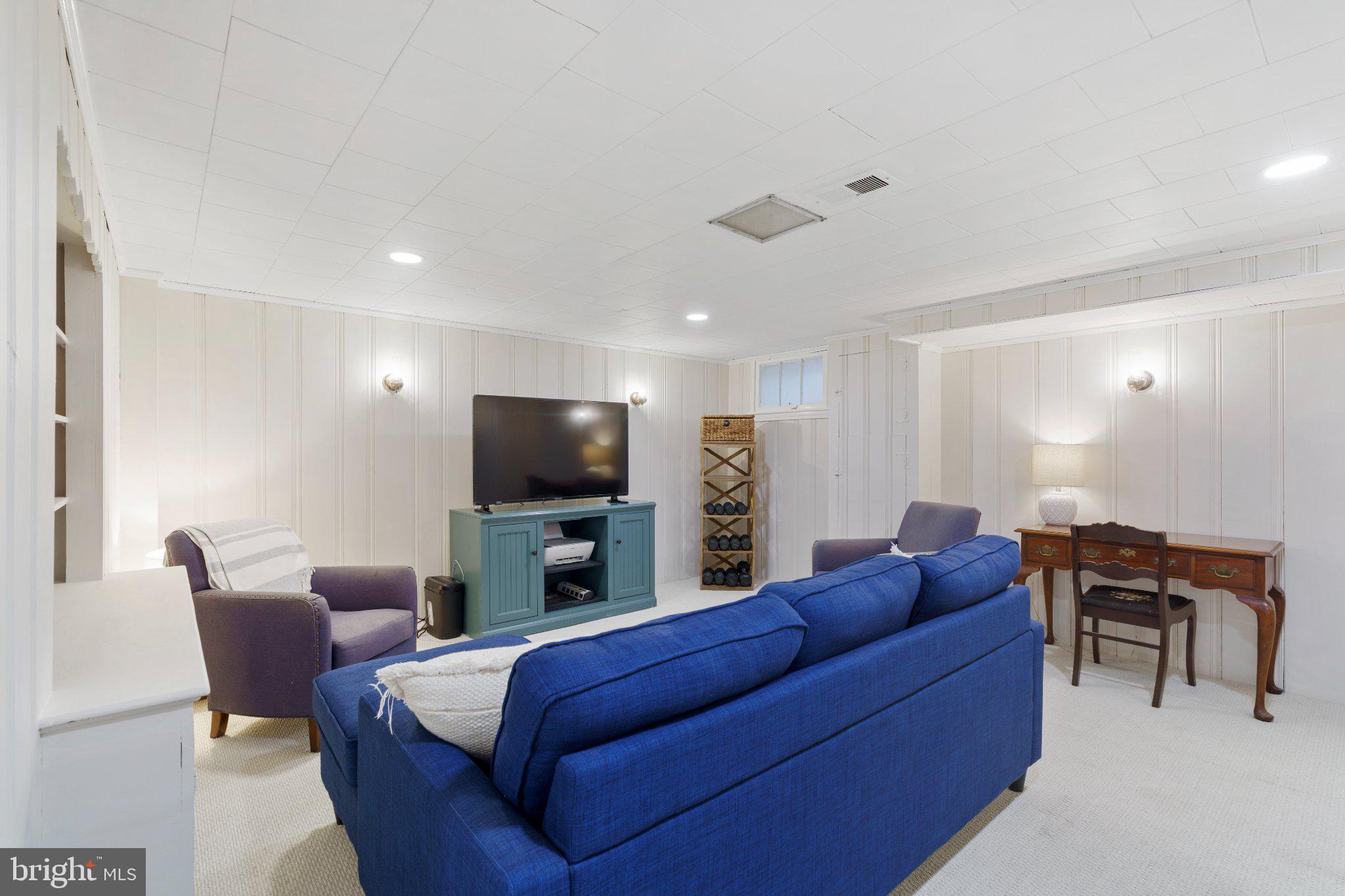 142 Regester Avenue Baltimore, MD 21212 - Photo 27 of 36 Cozy basement retreat with modern flair.