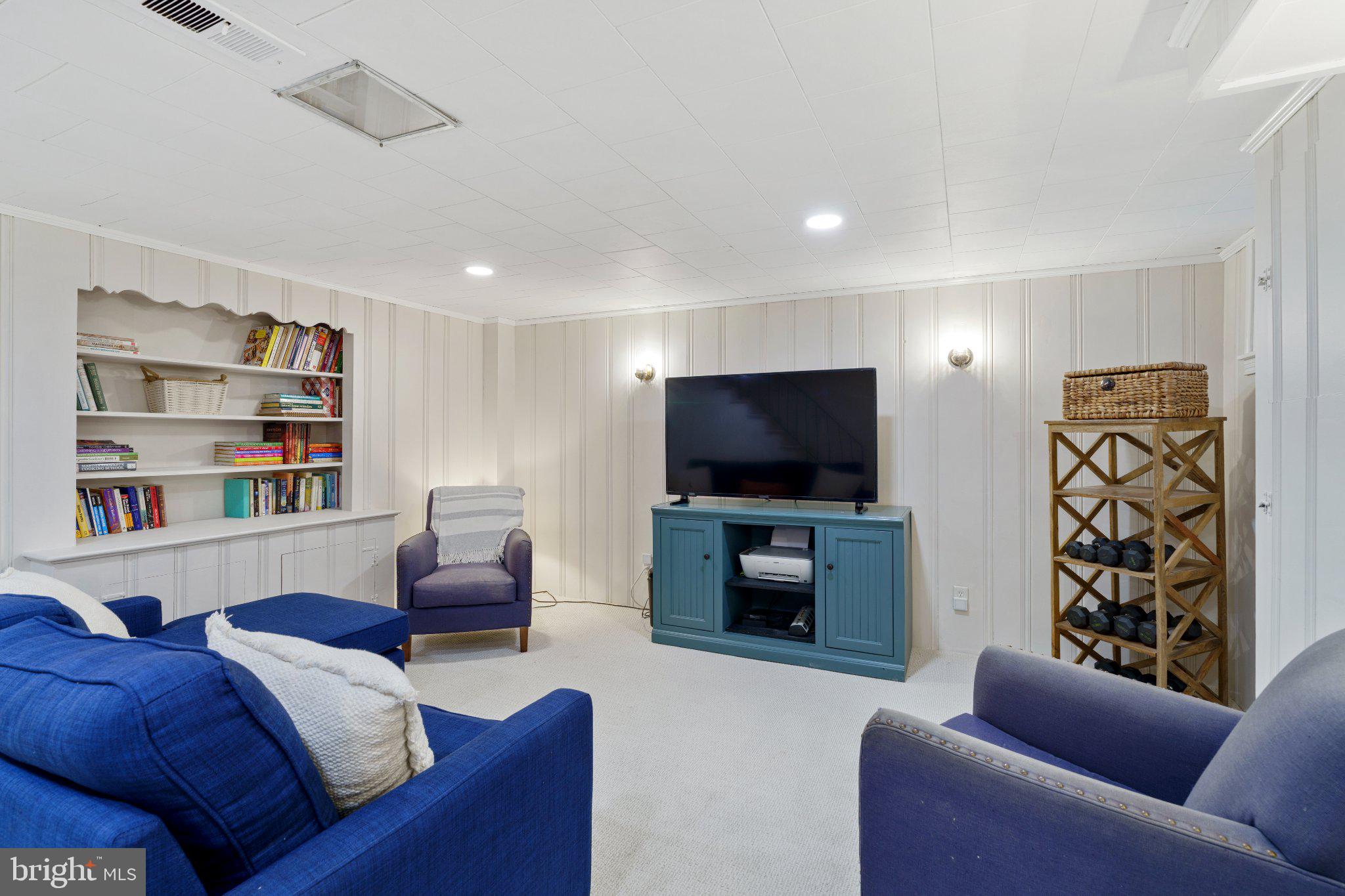 142 Regester Avenue Baltimore, MD 21212 - Photo 28 of 36 Cozy basement retreat with modern flair.