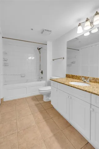 a bathroom with a bathtub and a sink