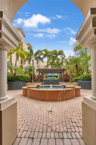 a view of swimming pool with outdoor seating and plants