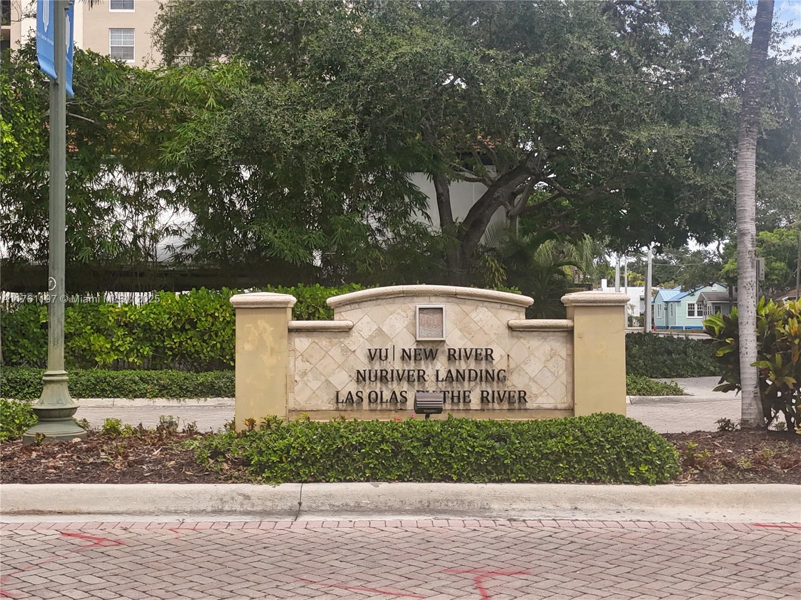 520 Southeast 5th Avenue, Unit 1507 Fort Lauderdale, FL 33301 - Photo 29 of 41 a view of a white house with a yard and large trees