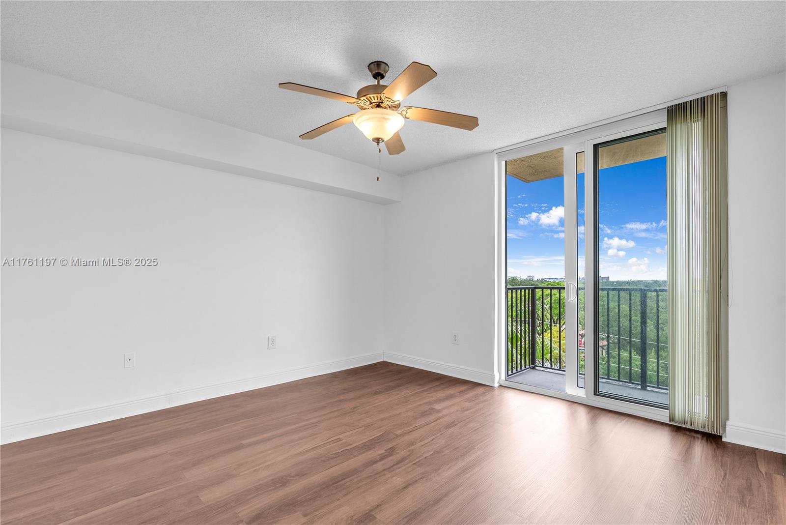 520 Southeast 5th Avenue, Unit 1507 Fort Lauderdale, FL 33301 - Photo 3 of 41 a view of an empty room with wooden floor and a window