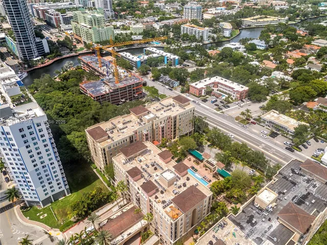 an aerial view of residential houses with outdoor space