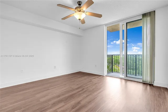 a view of an empty room with glass door