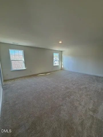 a bathroom with double vanity sinks and a large mirror