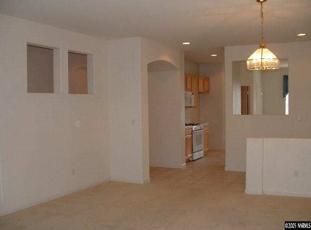 1702 Burwood Circle Reno, NV 89521 - Photo 3 of 9 a view of a kitchen with a sink and refrigerator