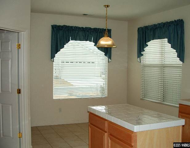 1702 Burwood Circle Reno, NV 89521 - Photo 5 of 9 a kitchen with a sink cabinets and window
