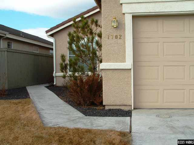1702 Burwood Circle Reno, NV 89521 - Photo 8 of 9 a view of a house with a yard