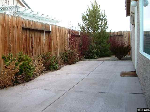 1702 Burwood Circle Reno, NV 89521 - Photo 9 of 9 a view of backyard with potted plants