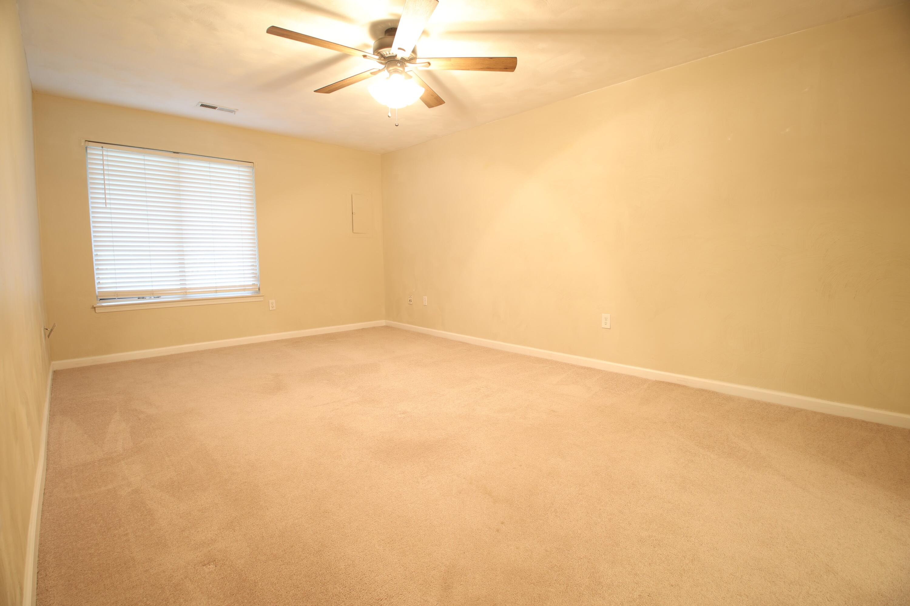 3351 Forest Ridge Road Roanoke, VA 24018 - Photo 8 of 10 an empty room with a window and a fan