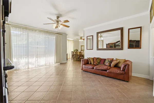 a view of livingroom with furniture and chandelier fan