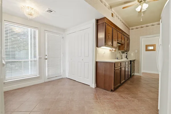 a view of a a dining room with furniture window and outside view
