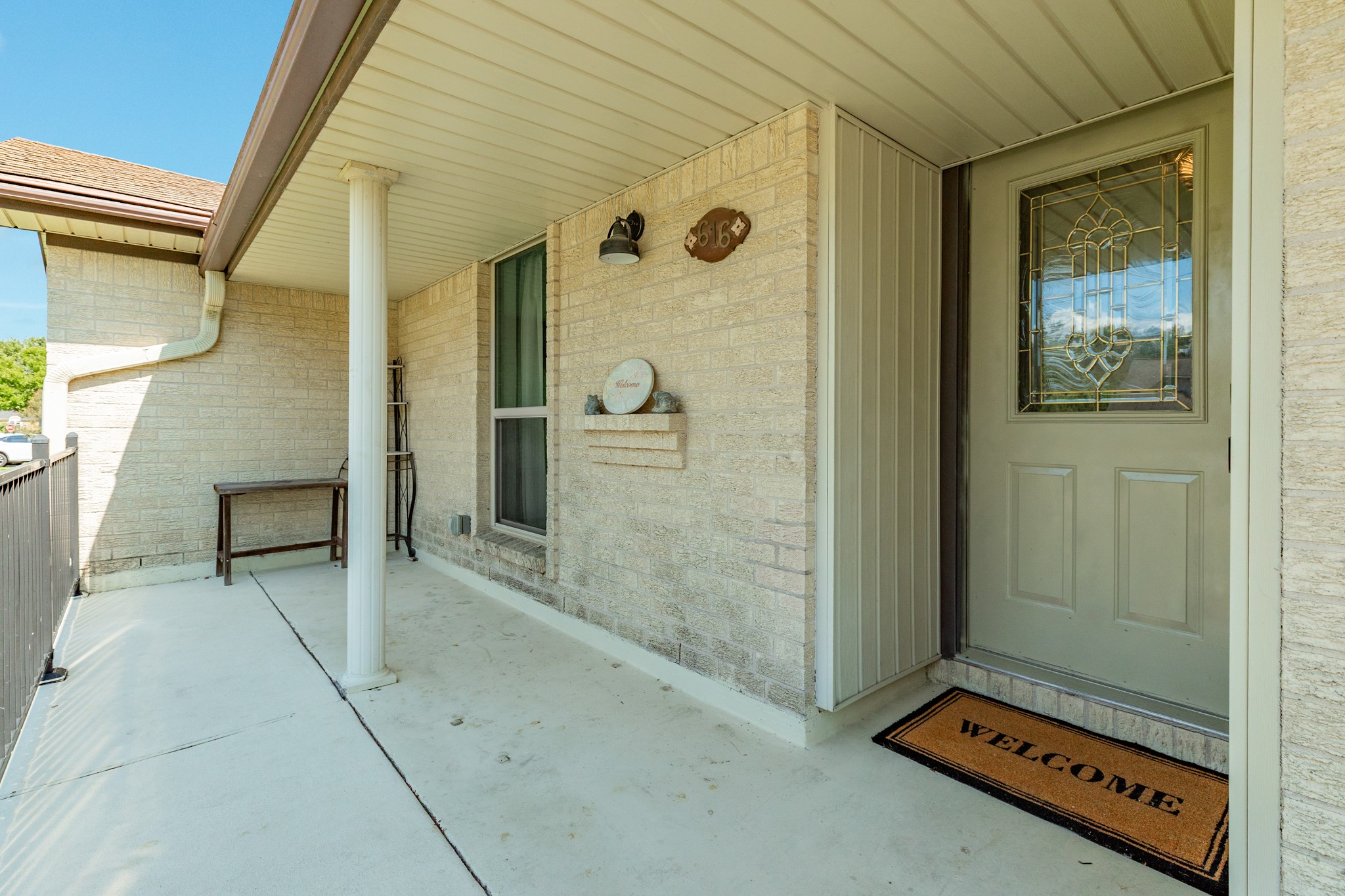 The generous covered entry provides a welcoming approach to the home and features a decorative glass front door.