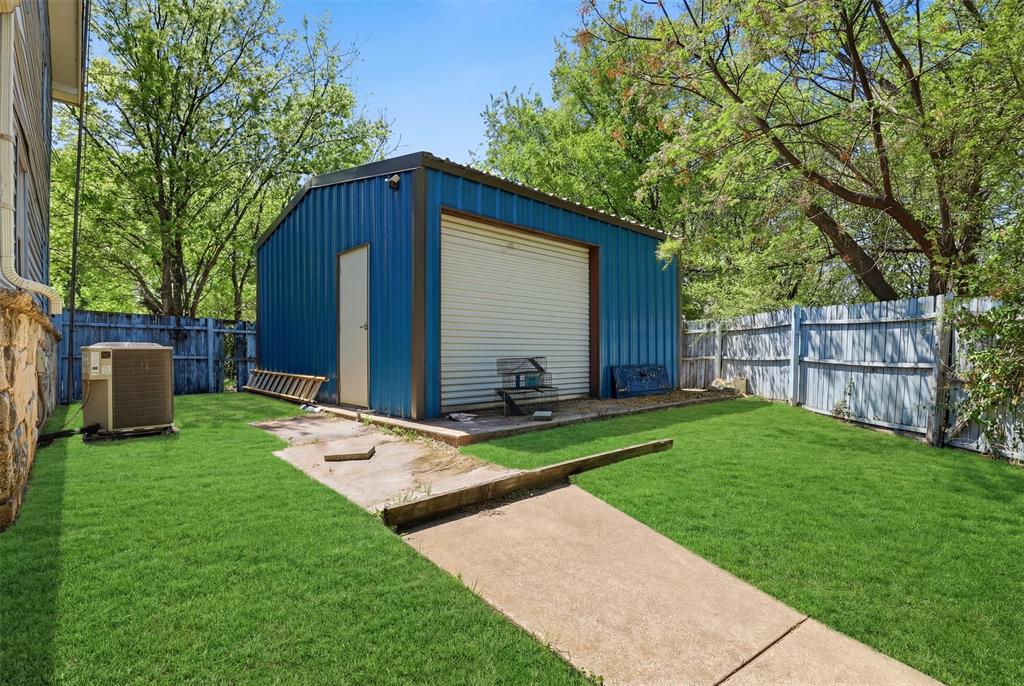 500 West Rucker Street Granbury, TX 76048 - Photo 15 of 35 400sf insulated Shop with electricity and roll up door