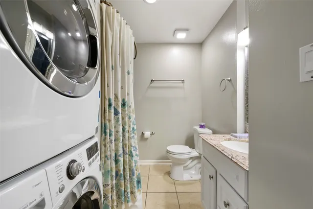 a bathroom with a toilet a sink and a mirror