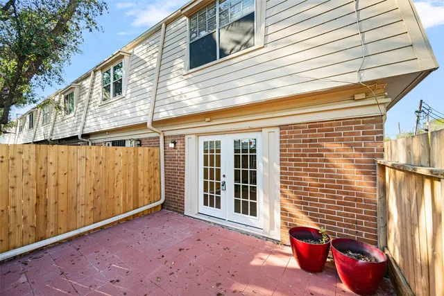 a view of a porch with wooden fence