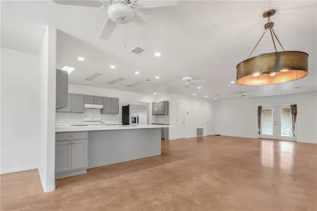 a view of kitchen with sink and microwave