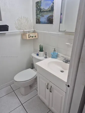 a bathroom with a toilet and a sink