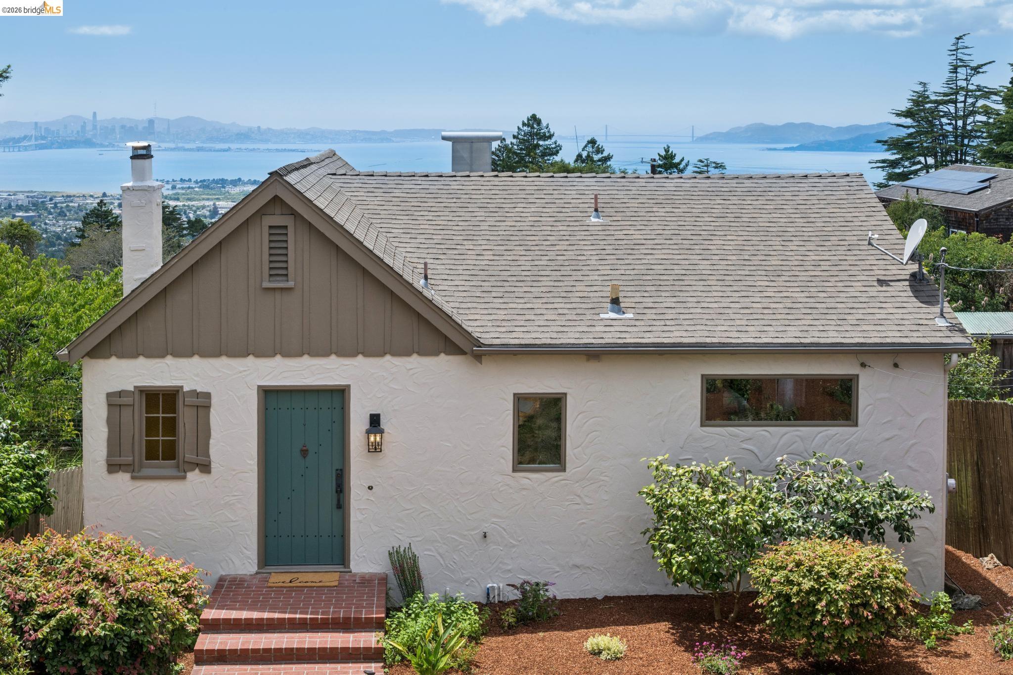 734 Keeler Avenue Berkeley, CA 94708 - Photo 1 of 1 a aerial view of a house with a yard and potted plants