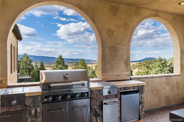 a room with furniture and a floor to ceiling window