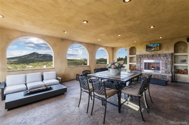 a view of a dining room with furniture window and outside view