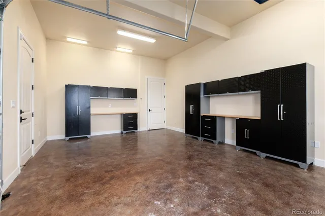 a view of empty room with a fireplace and window