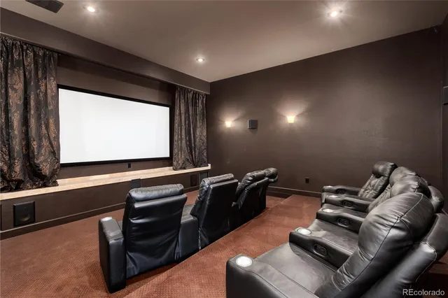 a room with furniture pool table and a projector screen