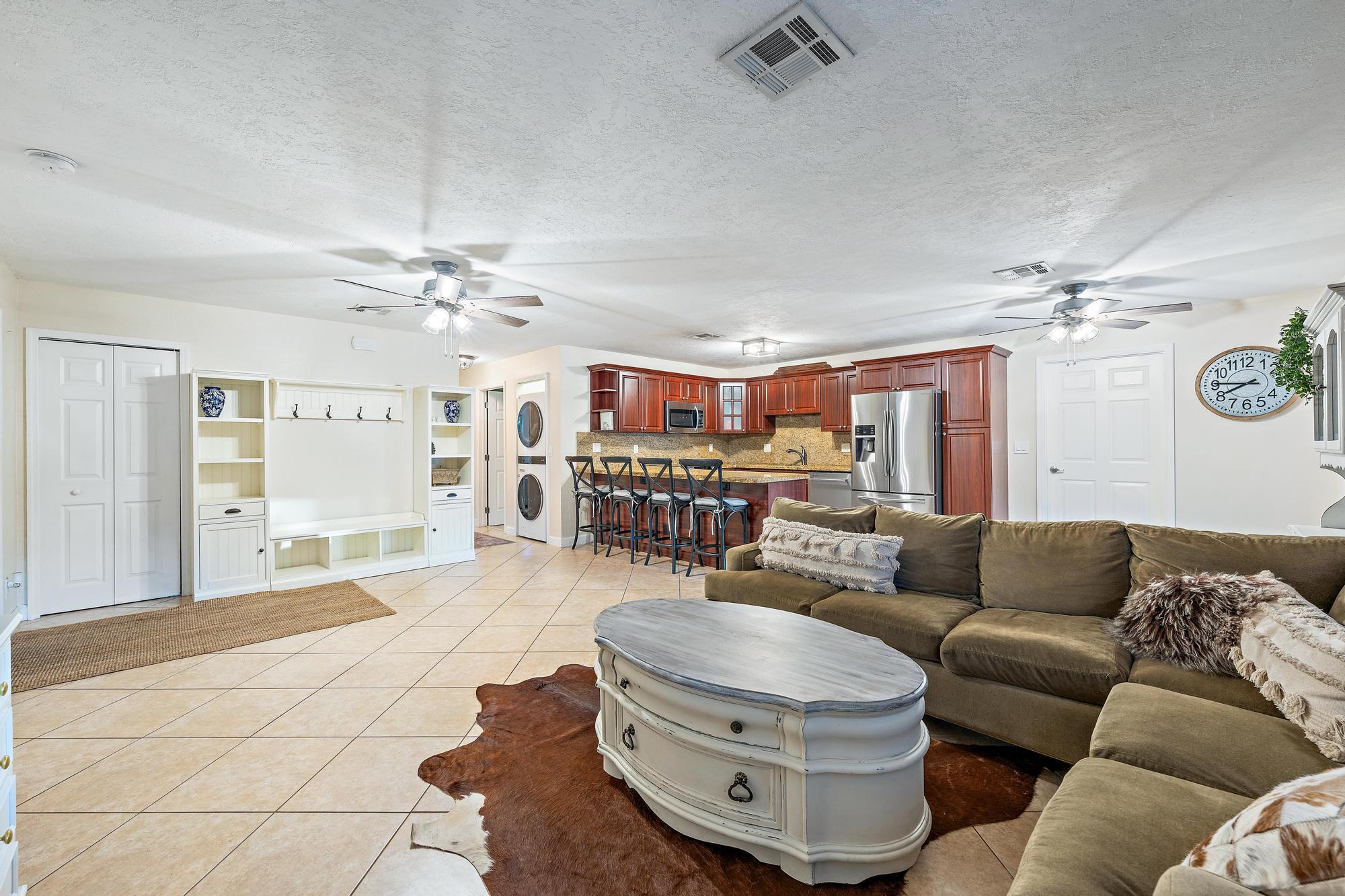 14765 Calusa Trail Palm Beach Gardens, FL 33418 - Photo 11 of 49 a living room with furniture and a chandelier
