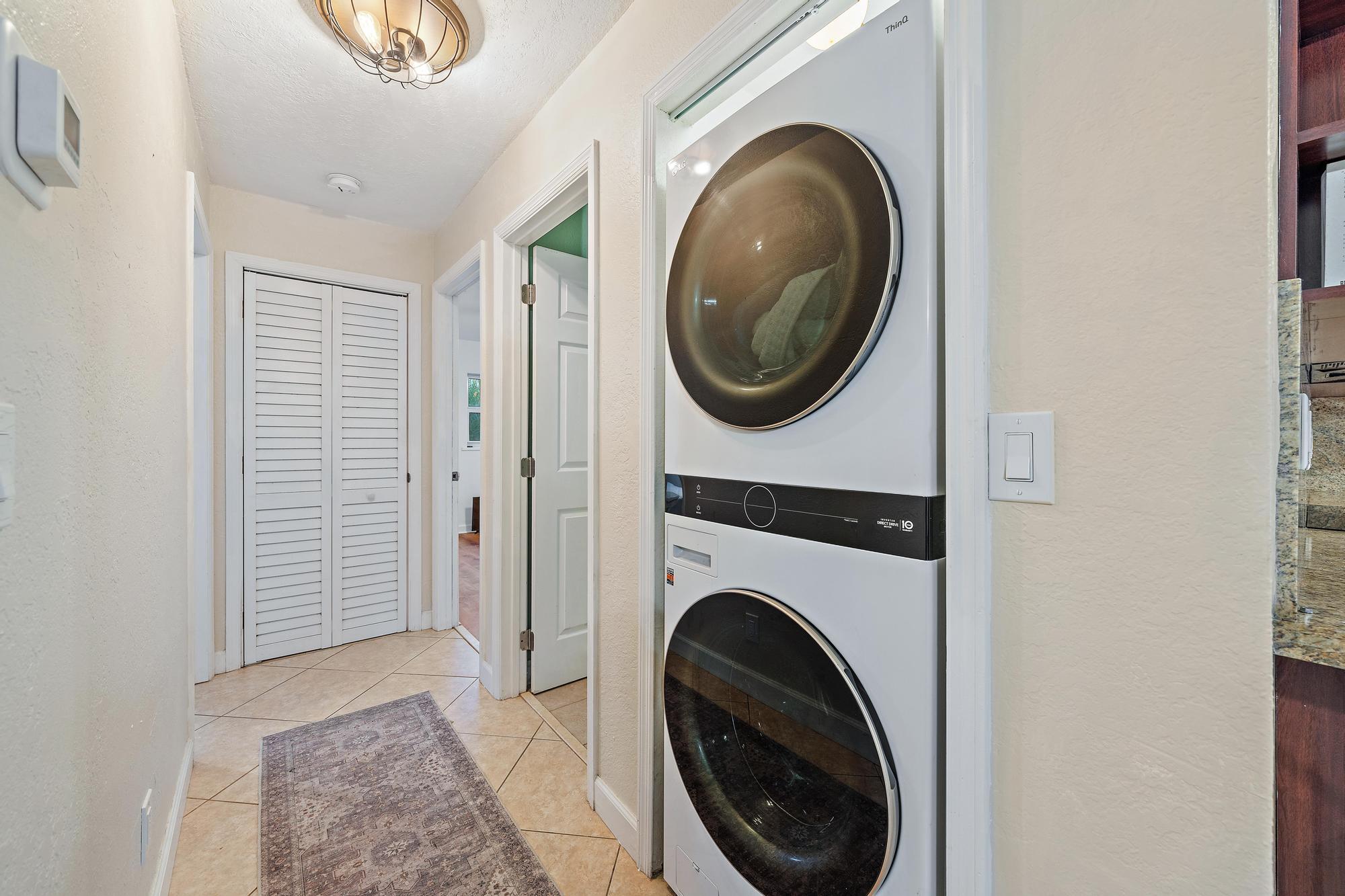 14765 Calusa Trail Palm Beach Gardens, FL 33418 - Photo 15 of 49 a view of a hallway with washer and dryer