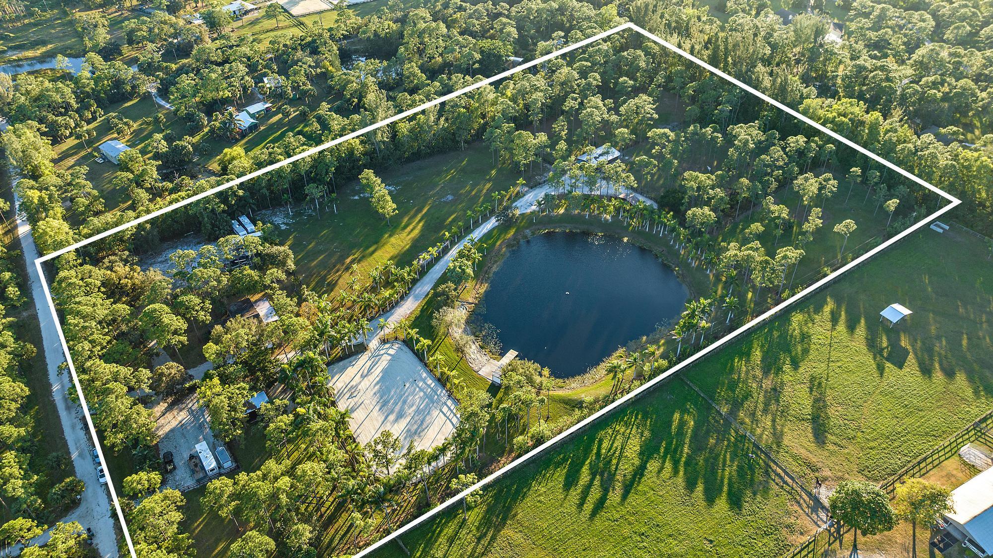 14765 Calusa Trail Palm Beach Gardens, FL 33418 - Photo 3 of 49 a view of swimming pool from a balcony