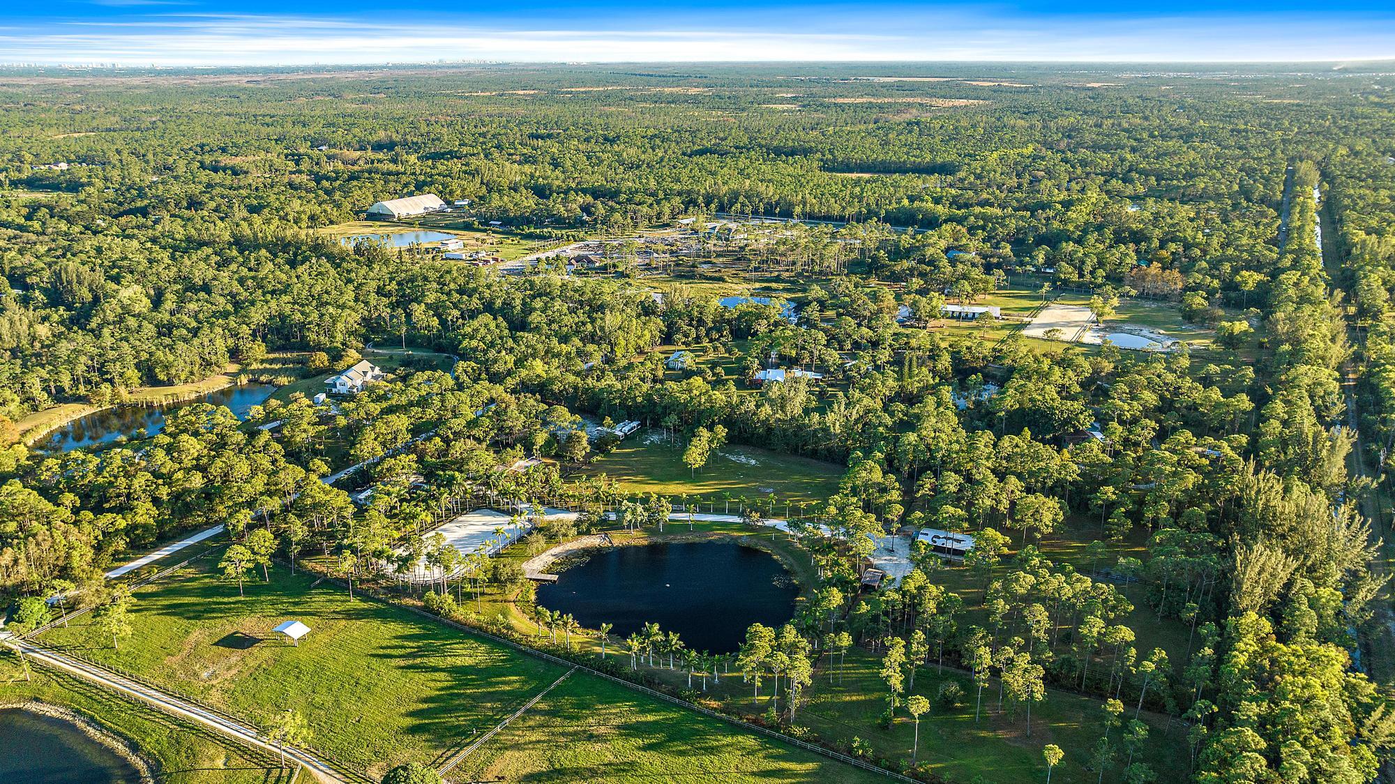 14765 Calusa Trail Palm Beach Gardens, FL 33418 - Photo 44 of 49 a view of a lake with a city