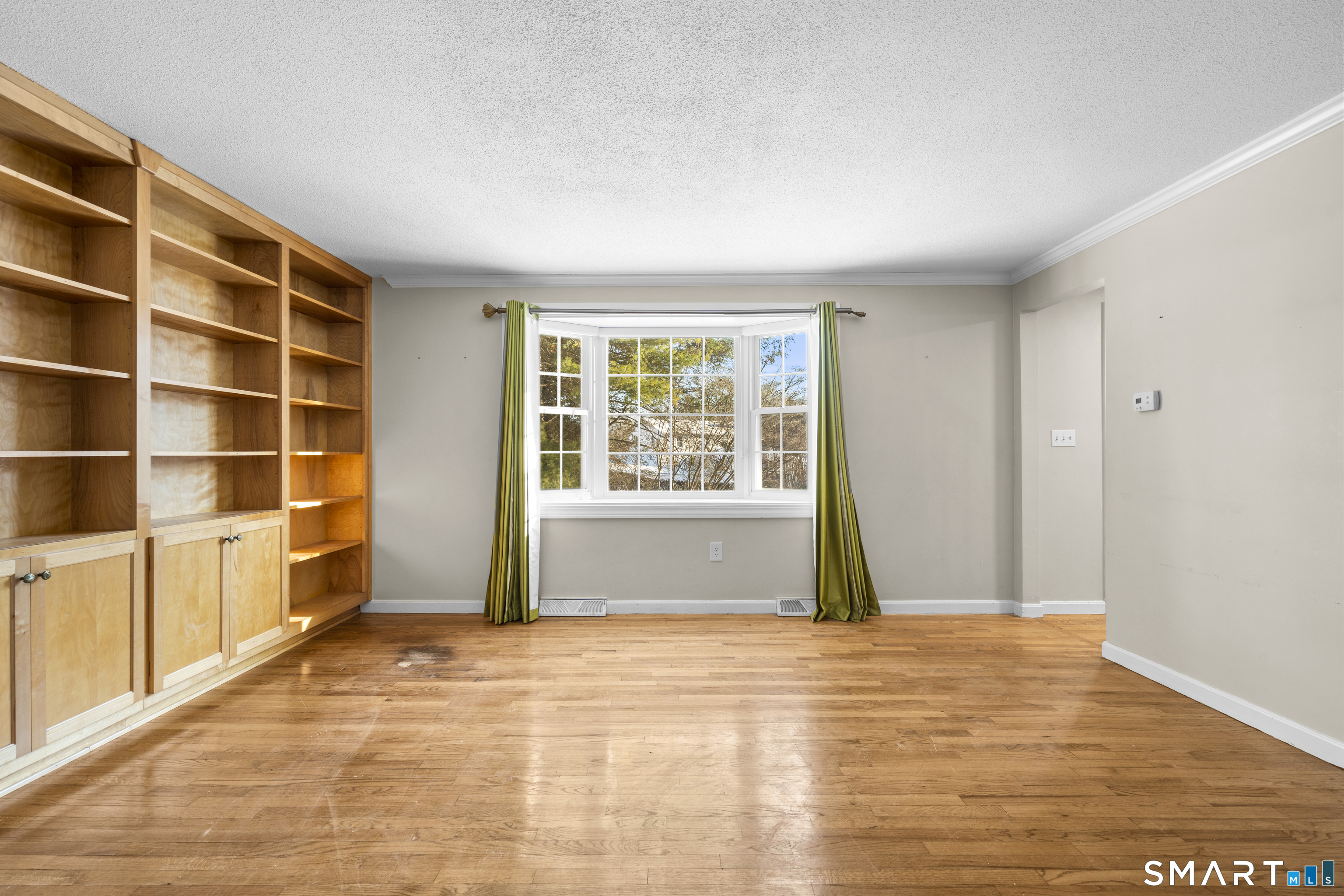 52 Laura Road Hamden, CT 06514 - Photo 11 of 35 a view of an empty room with a window