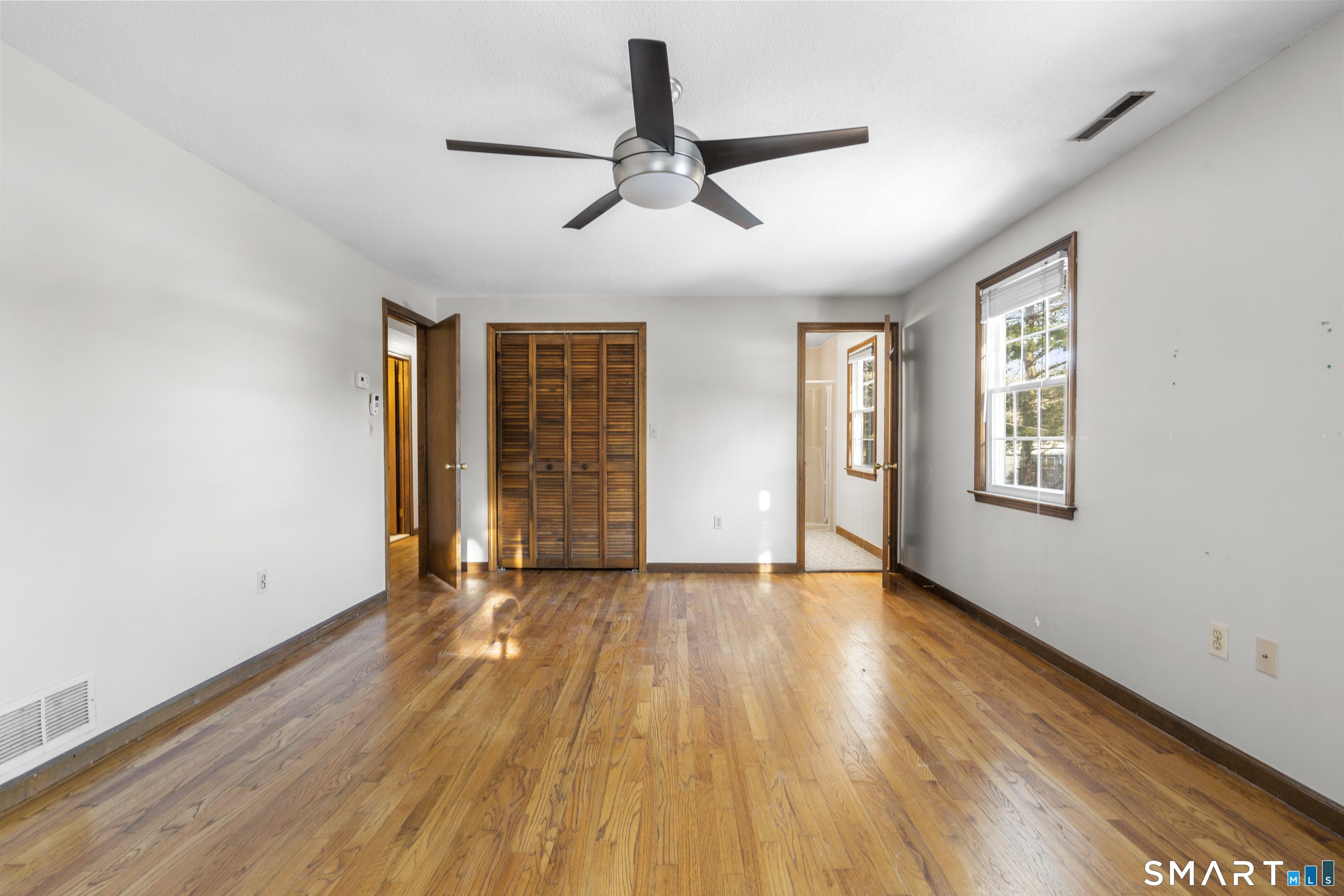 52 Laura Road Hamden, CT 06514 - Photo 15 of 35 a view of an empty room with wooden floor and a window