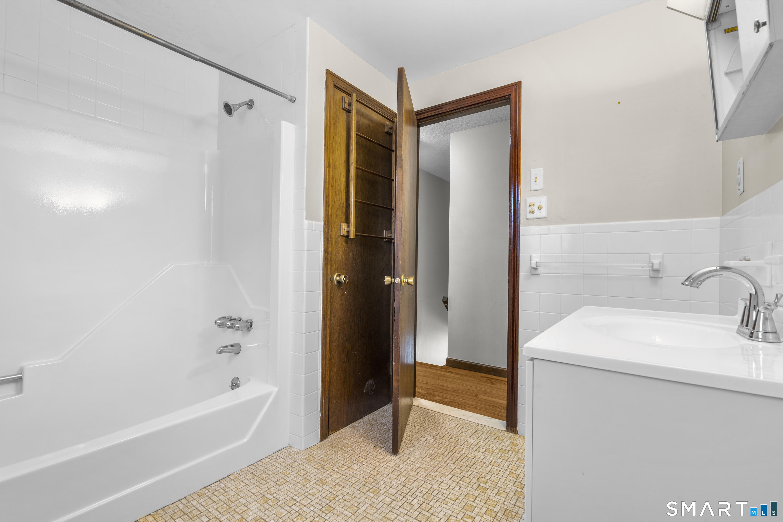 52 Laura Road Hamden, CT 06514 - Photo 23 of 35 a bathroom with a sink a toilet and shower