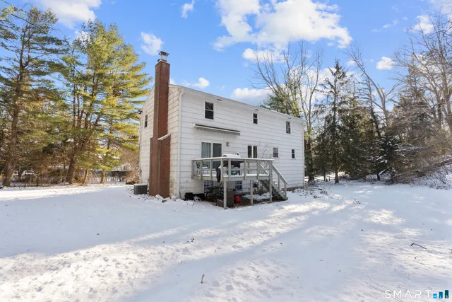 a view of a house with a snow in front of the house