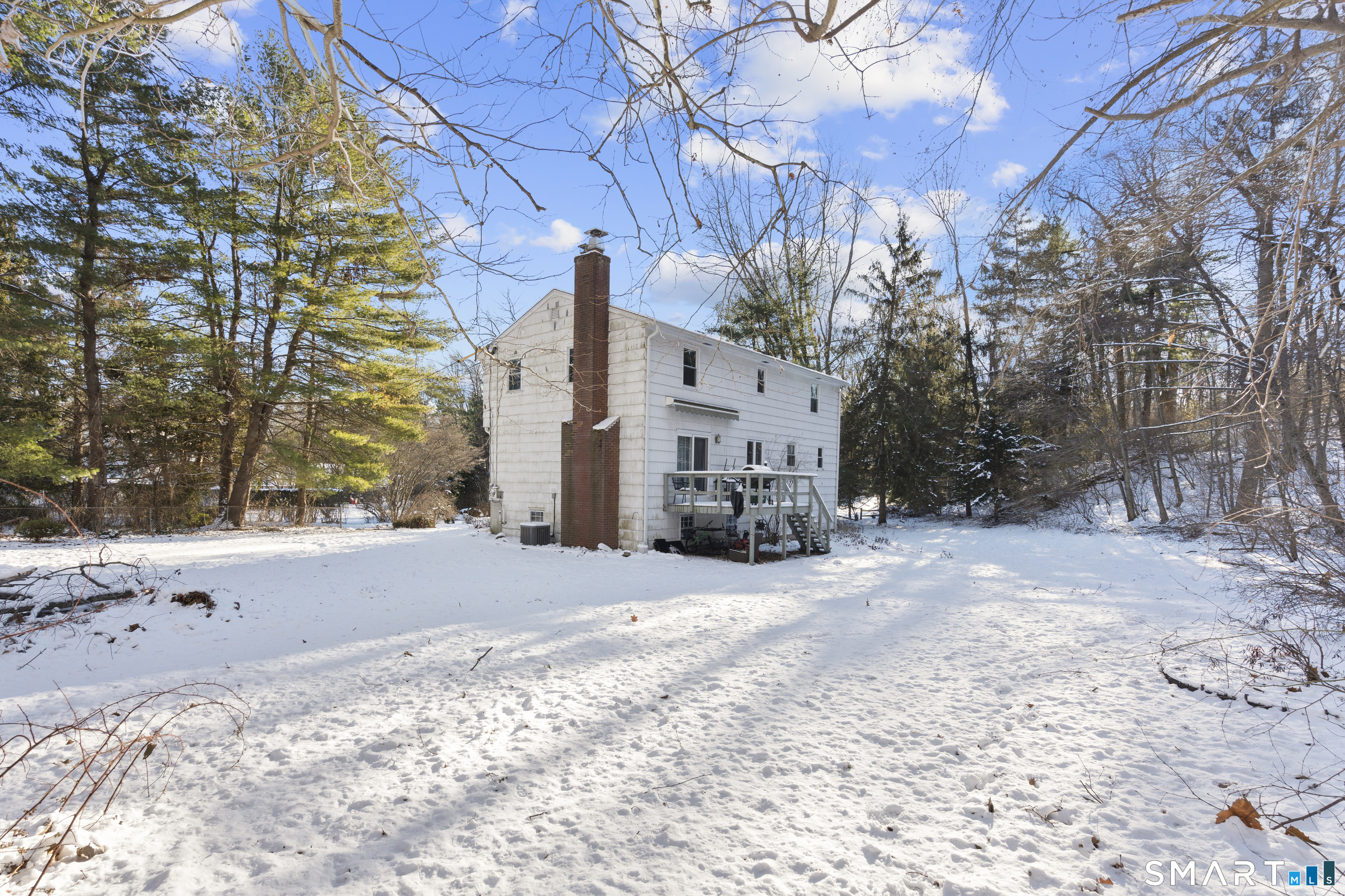 52 Laura Road Hamden, CT 06514 - Photo 32 of 35 a view of a house with a yard covered in snow