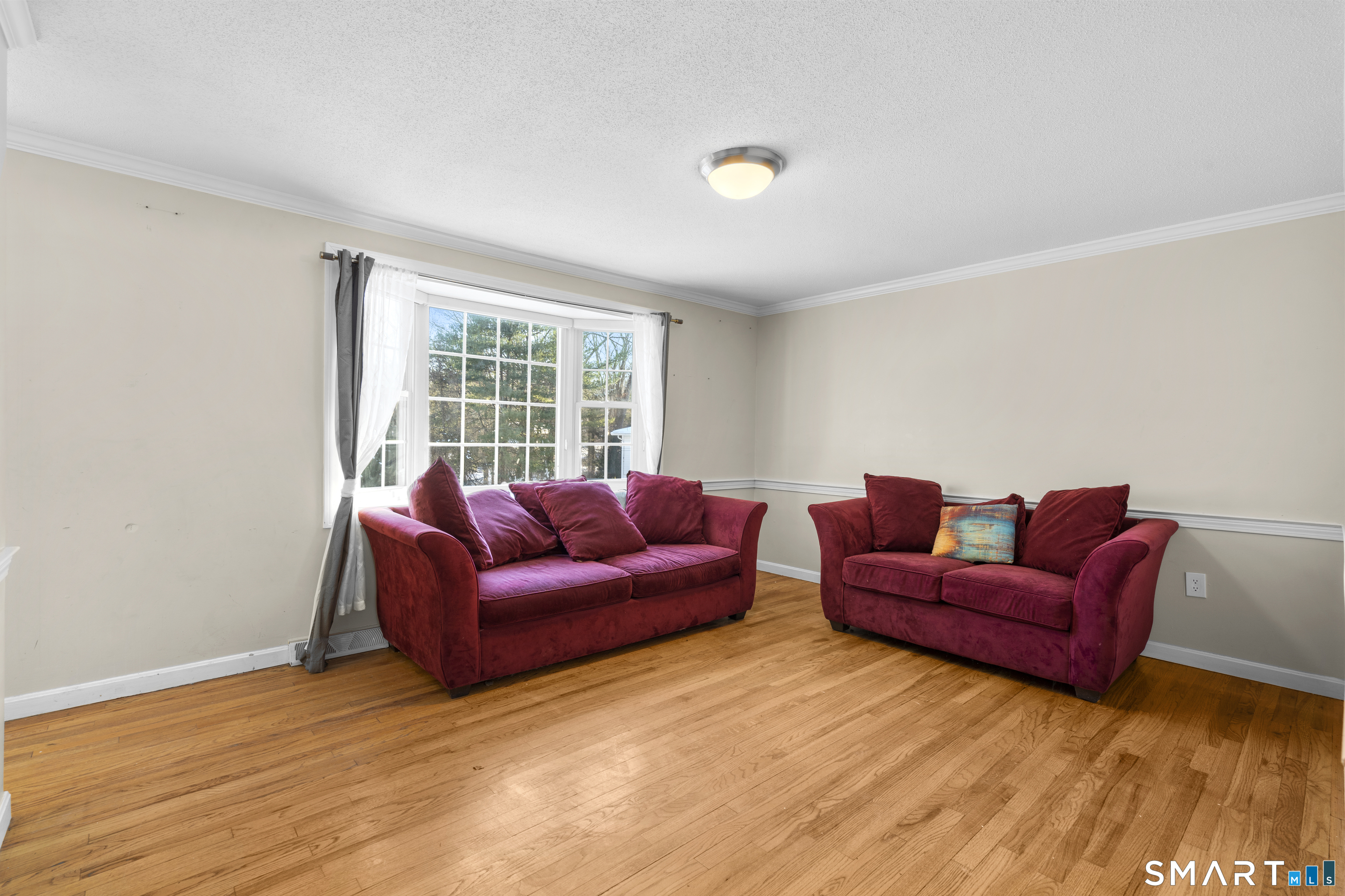 52 Laura Road Hamden, CT 06514 - Photo 6 of 35 a living room with furniture and a window