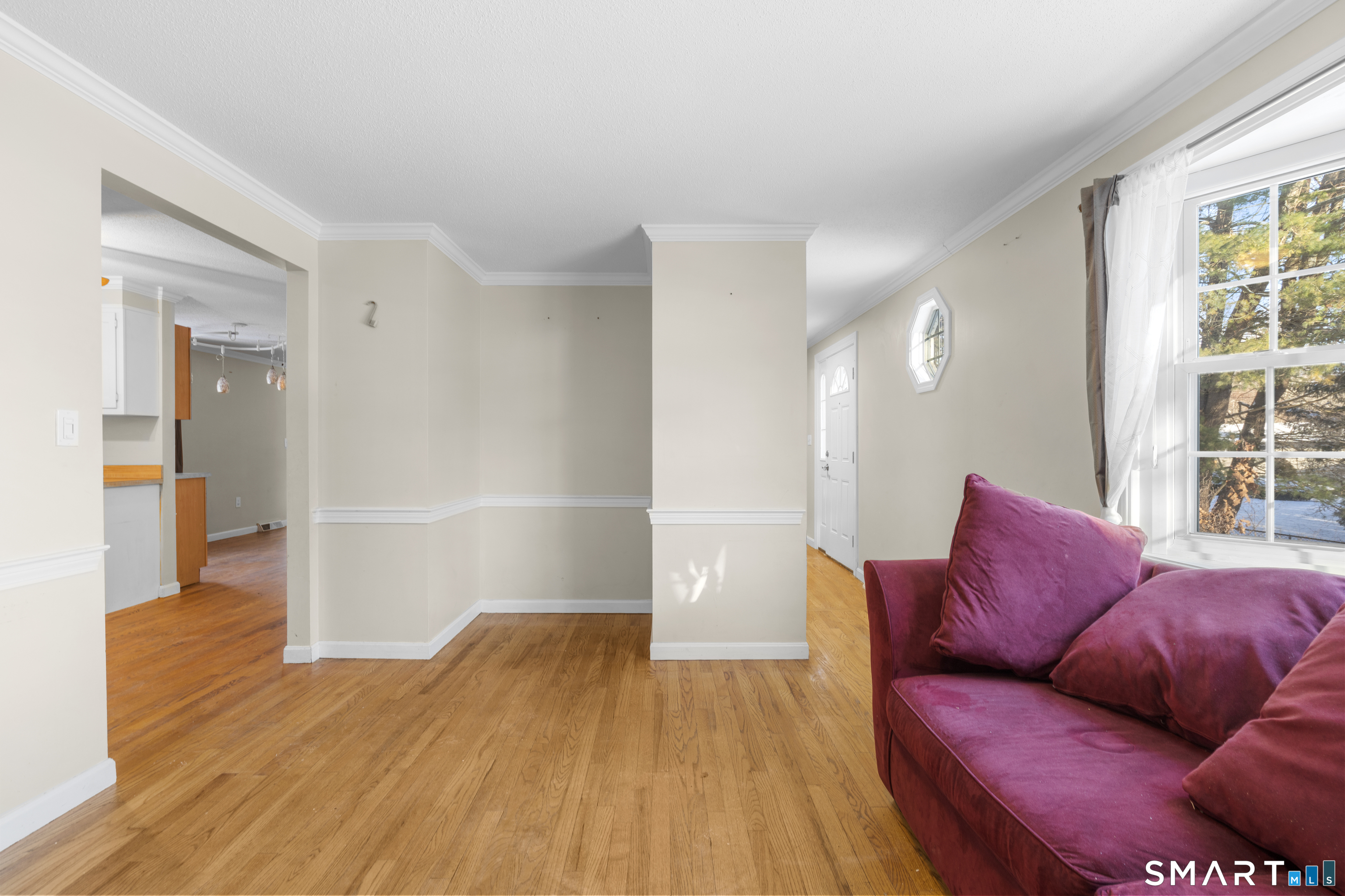 52 Laura Road Hamden, CT 06514 - Photo 7 of 35 a living room with furniture and a wooden floor
