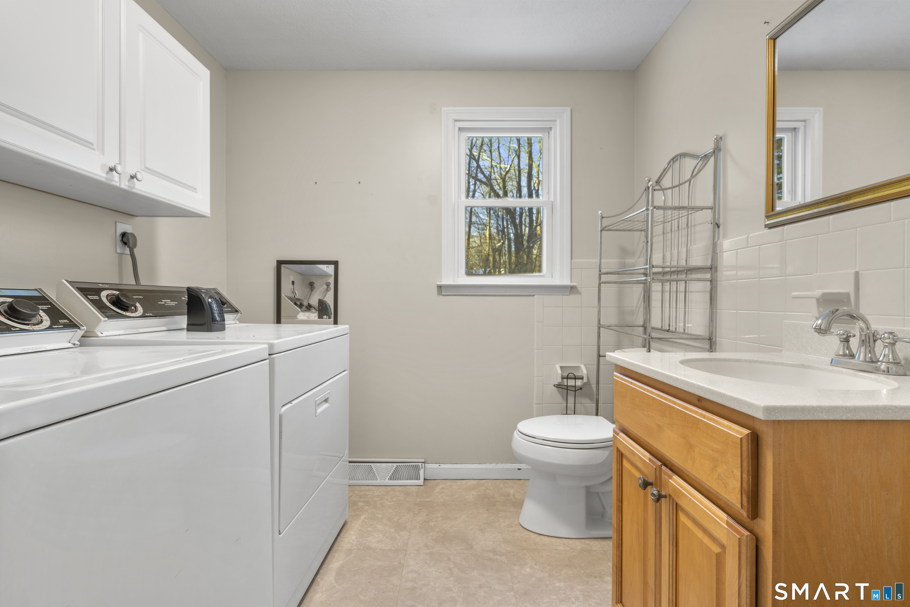 52 Laura Road Hamden, CT 06514 - Photo 10 of 35 a bathroom with a sink toilet and a vanity