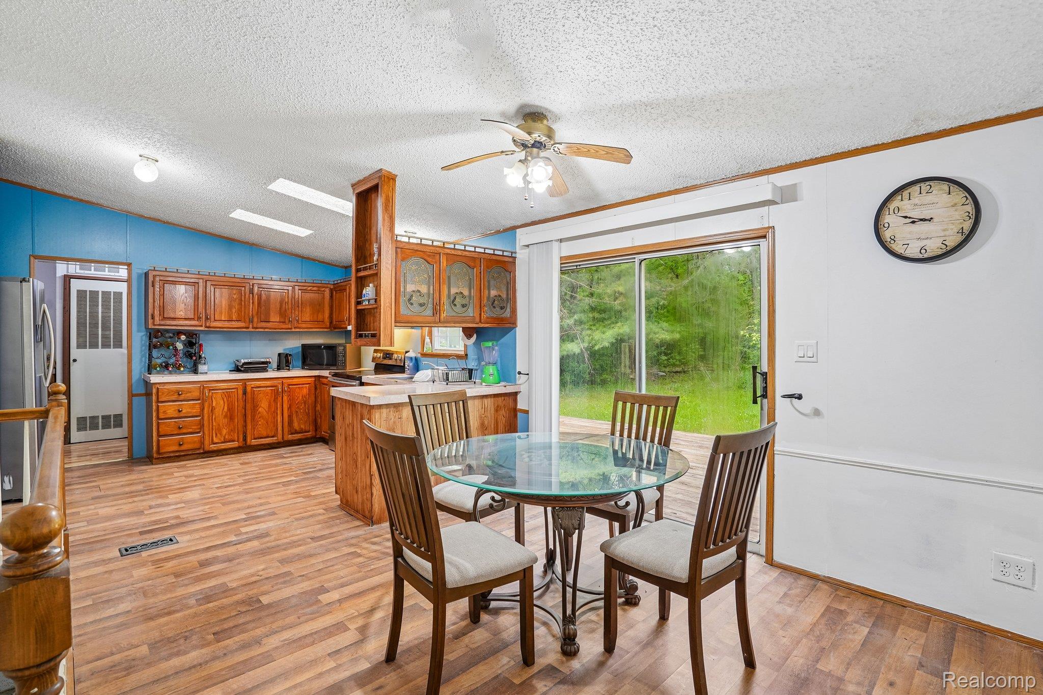 3363 North Branch Road North Branch, MI 48461 - Photo 13 of 38 Dining area with light wood-type flooring and a ceiling fan
