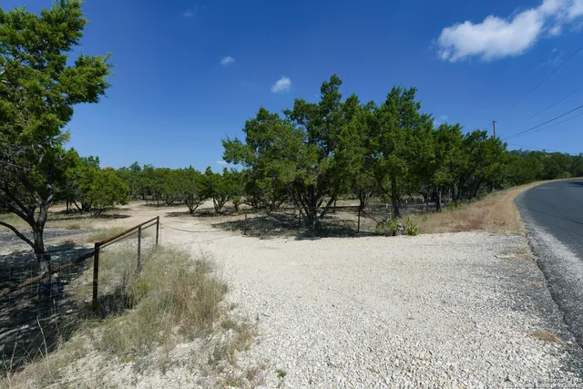 a view of backyard with outdoor and green space