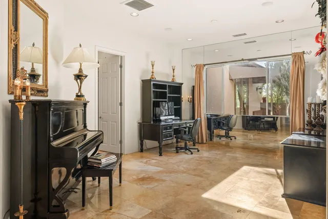 a bathroom with a shower sink and mirror