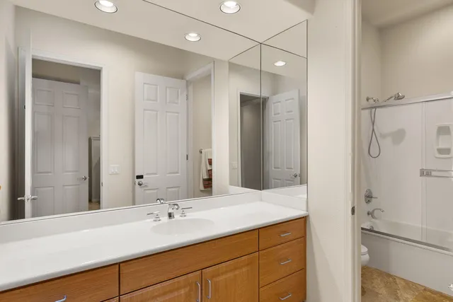 a bathroom with a sink double vanity and a mirror