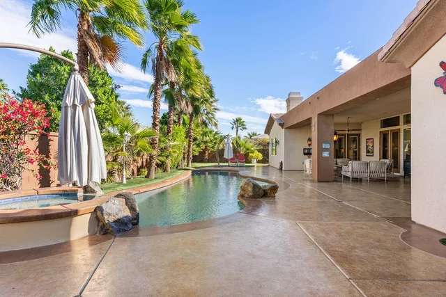 a view of a chairs and table in the patio