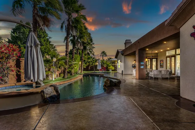 a view of swimming pool with outdoor seating