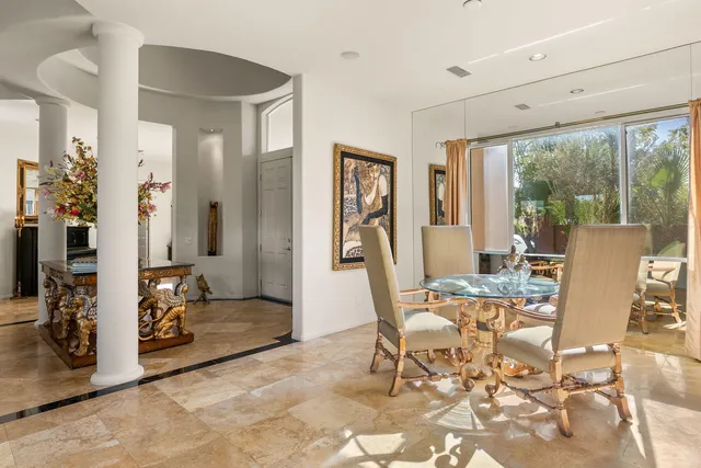 a view of a dining room with furniture window and outside view