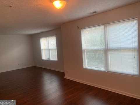 2204 Waldrop Place Decatur, GA 30034 - Photo 20 of 20 an empty room with wooden floor and windows