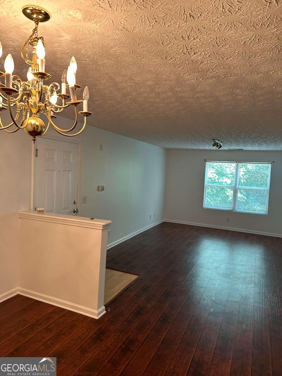 2204 Waldrop Place Decatur, GA 30034 - Photo 5 of 20 an empty room with wooden floor and windows